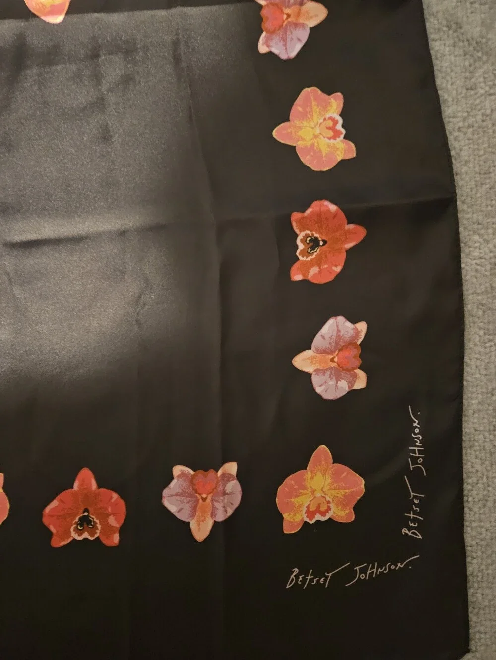 Betsey Johnson 100% polyester black scarf with skull and flowers.